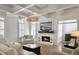 Bright living room with fireplace, comfortable seating, and coffered ceiling at 127 Beresford Creek St, Daniel Island, SC 29492