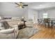 Comfortable living room with hardwood floors, plush seating, ceiling fan, and neutral tones at 127 Beresford Creek St, Daniel Island, SC 29492