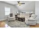Inviting living room with hardwood floors, ceiling fan, and comfortable neutral furnishings at 127 Beresford Creek St, Daniel Island, SC 29492