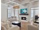 Bright living room with fireplace, comfortable seating, and coffered ceiling at 127 Beresford Creek St, Daniel Island, SC 29492