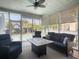 Cozy screened porch with comfortable seating and a view of the pool at 127 Beresford Creek St, Daniel Island, SC 29492