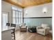 Cozy sitting area with natural light, comfortable armchairs, and hardwood floors at 127 Beresford Creek St, Daniel Island, SC 29492