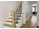 Elegant staircase with wooden steps and a modern black iron railing at 127 Beresford Creek St, Daniel Island, SC 29492