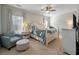 Bright bedroom features a decorative ceiling fan, ample natural light, and neutral color palette at 127 Surfbird Rd, Summerville, SC 29486