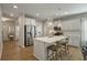 Modern kitchen with white cabinets, quartz countertops, a kitchen island, and stainless steel appliances at 127 Surfbird Rd, Summerville, SC 29486
