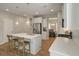 Bright kitchen with quartz countertops, a kitchen island, stainless steel appliances, and an open layout at 127 Surfbird Rd, Summerville, SC 29486