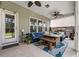 Inviting covered patio featuring comfortable seating, ceiling fans, and an outdoor dining area at 127 Surfbird Rd, Summerville, SC 29486