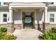Covered walkway with gated access offering a peek of the pool beyond at 127 Surfbird Rd, Summerville, SC 29486