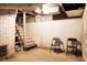 Large unfinished basement with brick walls and stairs at 1316 Wichman St, Walterboro, SC 29488