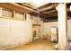 Unfinished basement space with water heater and storage at 1316 Wichman St, Walterboro, SC 29488
