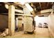 Unfinished basement space featuring exposed brick, ductwork, and space for storage or customization at 1316 Wichman St, Walterboro, SC 29488