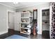 Neutral bedroom with closet, shelving, workout rowing machine, and doorway at 1316 Wichman St, Walterboro, SC 29488