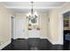 Dining room with built-in storage and black hardwood floors at 1316 Wichman St, Walterboro, SC 29488