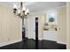Dining room with built-in storage and black hardwood floors at 1316 Wichman St, Walterboro, SC 29488