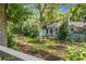 Charming single-story home with lush landscaping, colorful garden, and a decorative black fence at 1316 Wichman St, Walterboro, SC 29488
