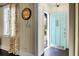 Welcoming foyer with a beautiful front door, classic wood paneling, and a unique vintage clock at 1316 Wichman St, Walterboro, SC 29488