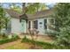 Welcoming front porch with mint door, fresh landscaping, and brick-lined walkway at 1316 Wichman St, Walterboro, SC 29488