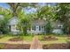 Charming single-story home with a brick pathway, lush landscaping, and a whimsical lawn ornament at 1316 Wichman St, Walterboro, SC 29488
