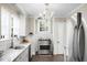 Bright kitchen featuring stainless steel appliances, granite counters, and a charming chandelier at 1316 Wichman St, Walterboro, SC 29488