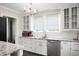 Bright kitchen featuring marble countertops and stainless steel appliances at 1316 Wichman St, Walterboro, SC 29488
