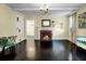 Living room featuring a fireplace, dark hardwood floors and bright yellow walls at 1316 Wichman St, Walterboro, SC 29488