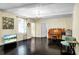 Living room with a piano, a television, shiny floors, and lots of light at 1316 Wichman St, Walterboro, SC 29488