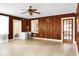 Living room featuring wood paneled walls and tiled floors at 1316 Wichman St, Walterboro, SC 29488