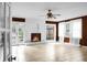 Spacious living room featuring fireplace, tile floors, and natural light from windows at 1316 Wichman St, Walterboro, SC 29488
