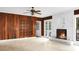 Living room featuring wood paneled walls, a fireplace, and tiled floors at 1316 Wichman St, Walterboro, SC 29488