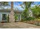 Exterior of the home featuring a brick chimney, patio, and inviting outdoor space at 1316 Wichman St, Walterboro, SC 29488