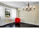 Sitting room with built-in shelves and bright white sheer curtains at 1316 Wichman St, Walterboro, SC 29488