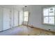 Bedroom featuring white closet doors, hardwood floors, and natural light at 1430 Hindman Ave, Mount Pleasant, SC 29464