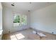 Bright bedroom with hardwood floors and large windows offering tree views at 1430 Hindman Ave, Mount Pleasant, SC 29464