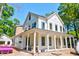 New two-story home featuring a covered wraparound porch with white pillars at 1430 Hindman Ave, Mount Pleasant, SC 29464