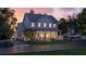 Inviting two-story home with a charming wraparound porch and lush green lawn at 1430 Hindman Ave, Mount Pleasant, SC 29464