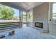 Covered outdoor space showcasing an in-wall fireplace ready for finishing with views of the backyard at 1430 Hindman Ave, Mount Pleasant, SC 29464