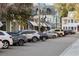 Charming street view of shops with awnings and apartments with a sidewalk and cars parked alongside the road at 1430 Hindman Ave, Mount Pleasant, SC 29464