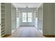 Spacious walk-in closet featuring built in shelving and rods, with a large window for natural light at 1430 Hindman Ave, Mount Pleasant, SC 29464