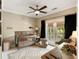 Cozy Bedroom features a wooden crib, area rug, ceiling fan, and balcony access, perfect for a young comfort at 1505 Rivertowne Country Club Dr, Mount Pleasant, SC 29466