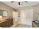 Bedroom boasting neutral tones, a ceiling fan, a large closet, and an area rug, offering a cozy and stylish space at 1505 Rivertowne Country Club Dr, Mount Pleasant, SC 29466
