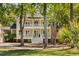 Charming two-story home with a welcoming double front porch and picturesque landscaping at 1505 Rivertowne Country Club Dr, Mount Pleasant, SC 29466