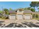 Spacious three-car garage with ample parking and attractive curb appeal at 1505 Rivertowne Country Club Dr, Mount Pleasant, SC 29466