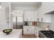 Modern kitchen featuring white cabinets, stainless steel appliances, and sleek countertops at 1505 Rivertowne Country Club Dr, Mount Pleasant, SC 29466