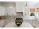 Spacious kitchen boasts modern appliances, ample counter space, and stylish pendant lighting at 1505 Rivertowne Country Club Dr, Mount Pleasant, SC 29466