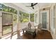 Relaxing outdoor porch area with comfortable seating and wooded views at 1505 Rivertowne Country Club Dr, Mount Pleasant, SC 29466