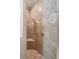 Neutral tiled shower with built in seat and shower head at 1505 Rivertowne Country Club Dr, Mount Pleasant, SC 29466