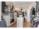 Large walk-in closet features custom shelving, drawers, and ample storage space at 1505 Rivertowne Country Club Dr, Mount Pleasant, SC 29466