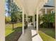 Charming walkway with pergola leading to a serene outdoor space with pool at 1505 Rivertowne Country Club Dr, Mount Pleasant, SC 29466
