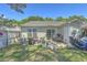 Backyard featuring a lawn, patio, and tidy landscaping at 1507 Blaze Ln, Charleston, SC 29412
