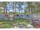 Fenced backyard with a charming patio area and potted flowers at 1507 Blaze Ln, Charleston, SC 29412